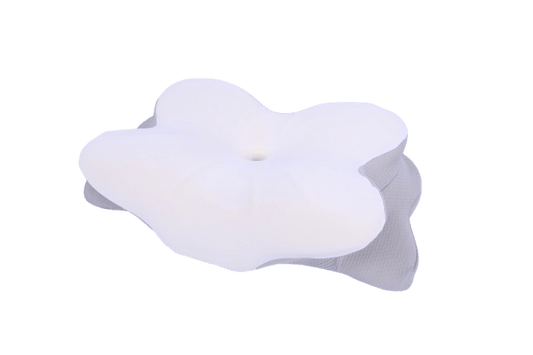 Orthopaedic memory foam pillow with central dip for neck support and pressure relief.